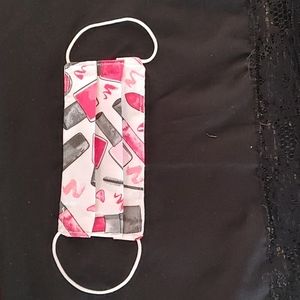 Nail technician face mask with nail polish